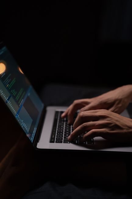 Laptop with Python code on screen